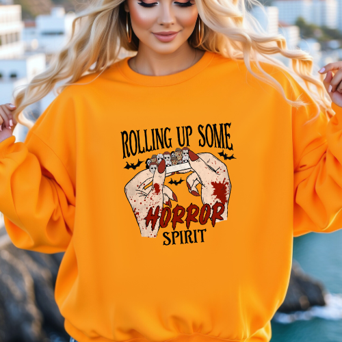 Rolling Up Some Horror Spirit design on an orange crewneck sweatshirt