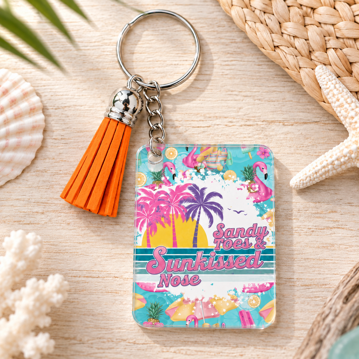Sandy Toes Sunkissed Nose keychain with orange tassel