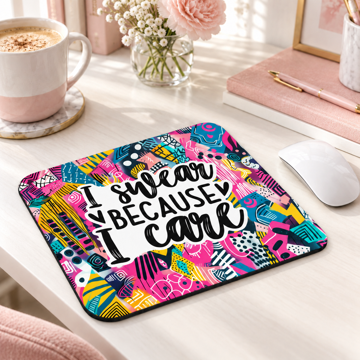 I Swear Because I Care mouse pad with bold teal, pink and yellow abstract patterns