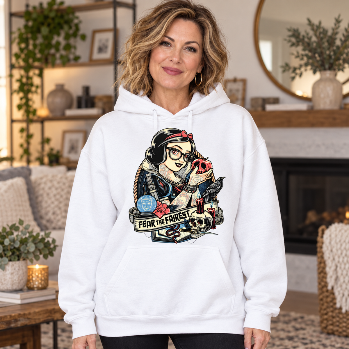 Woman wearing Fear the Fairest white hoodie
