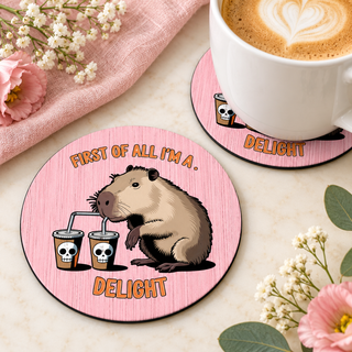First of All I'm a Delight Capybara round coaster set of two with thin black rubber backing