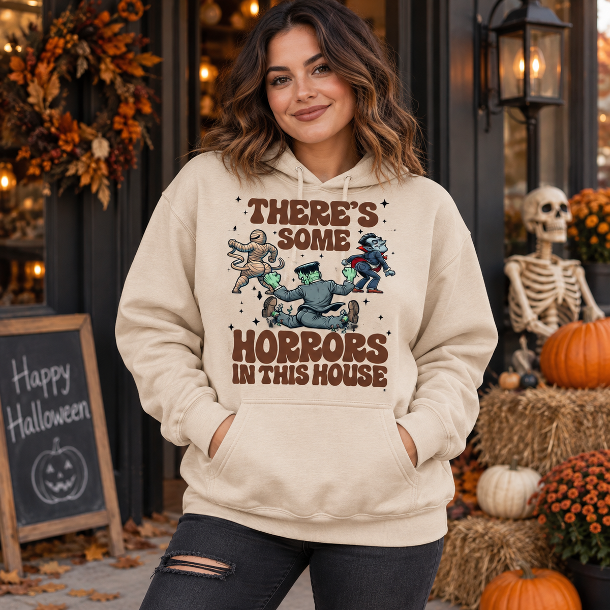 Model wearing There's Some Horrors in This House Halloween hoodie