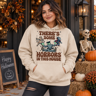 Model wearing There's Some Horrors in This House Halloween hoodie