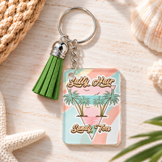 Salty Hair Sandy Toes keychain with green tassel