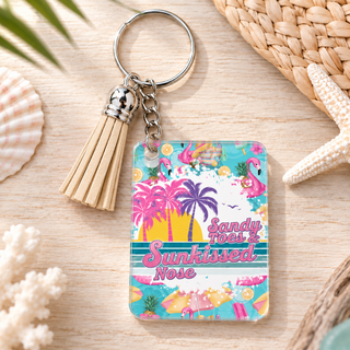 Sandy Toes Sunkissed Nose keychain with beige tassel