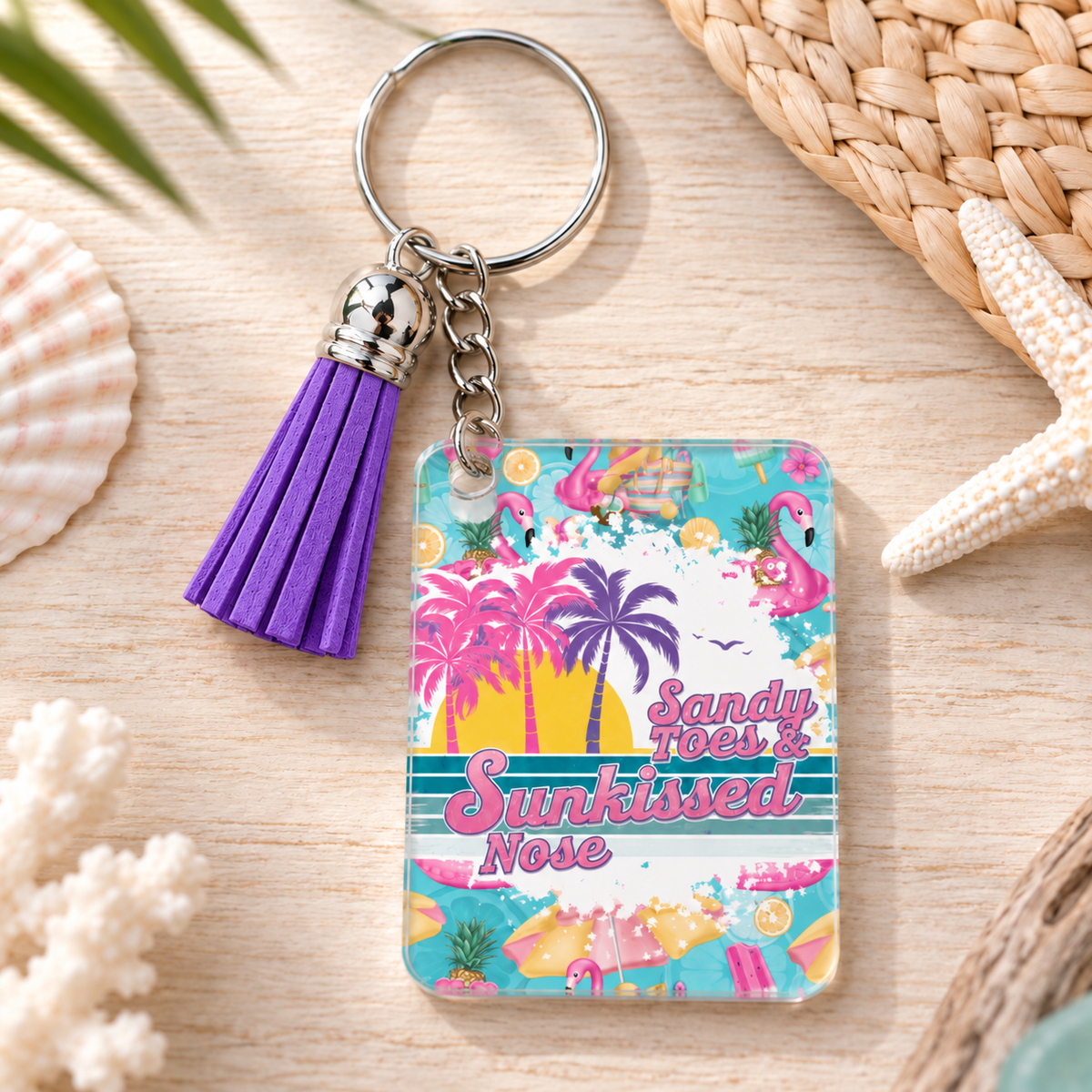 Sandy Toes Sunkissed Nose keychain with purple tassel